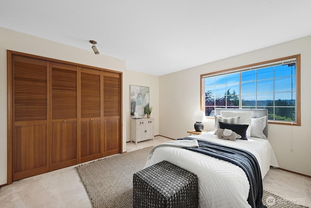 16909 NE 37th Pl, Bellevue, WA 98008 - bedroom with light carpet and a closet