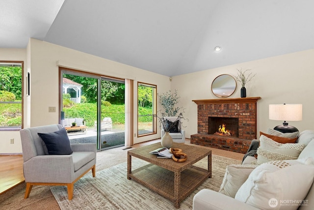 16909 NE 37th Pl, Bellevue, WA 98008 - living room featuring lofted ceiling, a fireplace, and recessed lighting