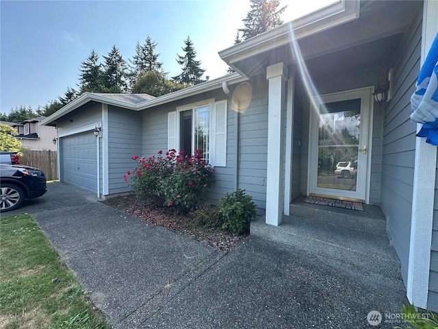 15015 105th Ave SE, Yelm, WA 98597 - view of side of property featuring an attached garage and driveway