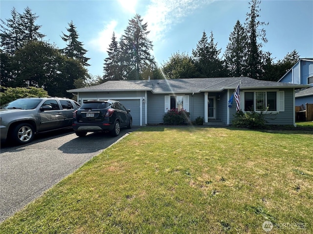 15015 105th Ave SE, Yelm, WA 98597 - ranch-style home featuring driveway, a garage, and a front yard
