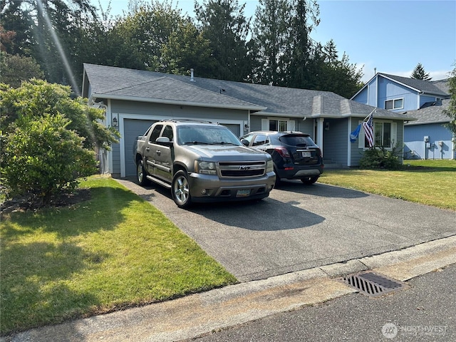 15015 105th Ave SE, Yelm, WA 98597 - view of front of property with driveway, a garage, a front lawn, and a shingled roof