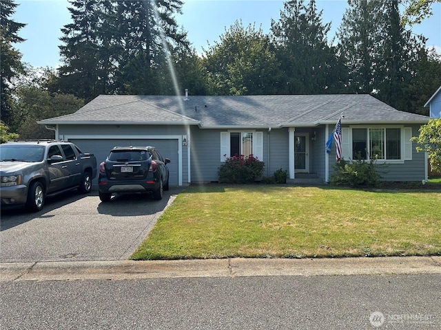 15015 105th Ave SE, Yelm, WA 98597 - single story home with an attached garage, driveway, and a front yard
