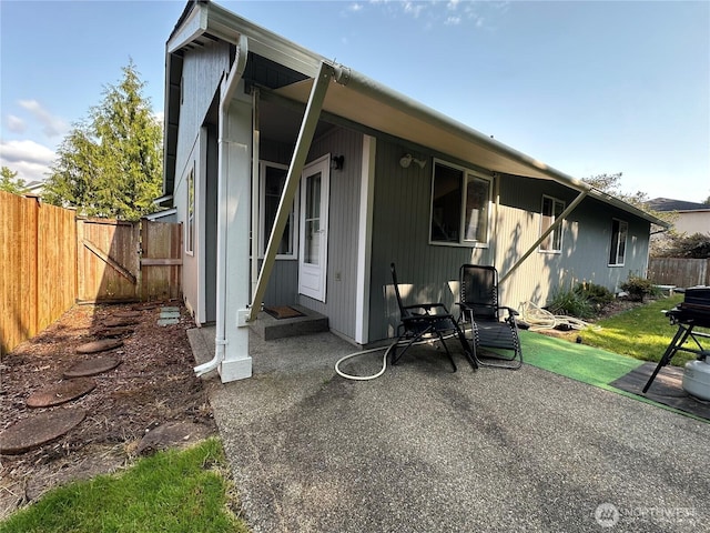 15015 105th Ave SE, Yelm, WA 98597 - rear view of property with a gate and a patio area