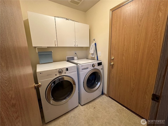15015 105th Ave SE, Yelm, WA 98597 - washroom featuring cabinet space and washer and clothes dryer