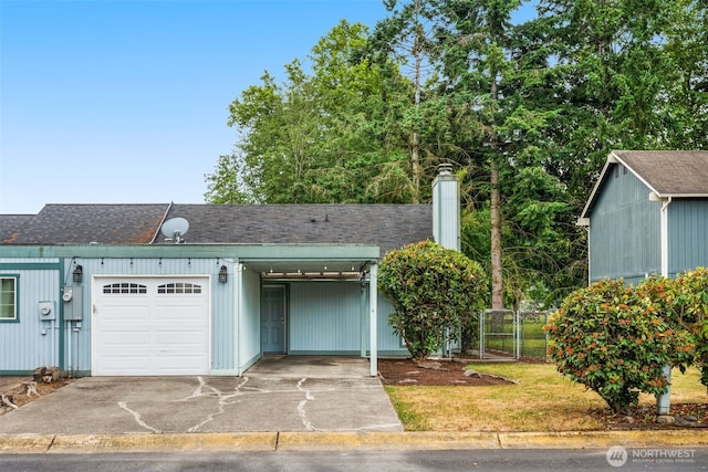 1116 30th St NE, Auburn, WA 98002 - view of front of property featuring driveway, a shingled roof, a carport, and an attached garage