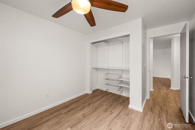1116 30th St NE, Auburn, WA 98002 - unfurnished bedroom featuring light wood-type flooring, a closet, and a ceiling fan