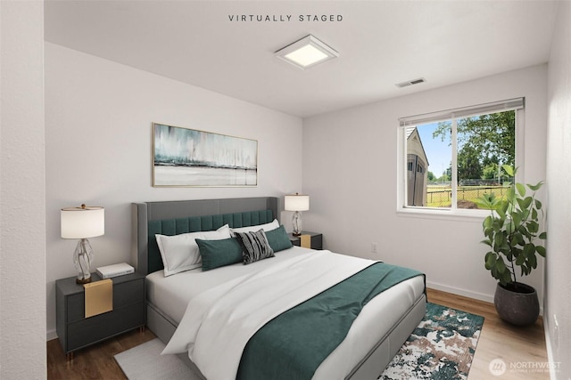 1116 30th St NE, Auburn, WA 98002 - bedroom featuring wood finished floors and baseboards