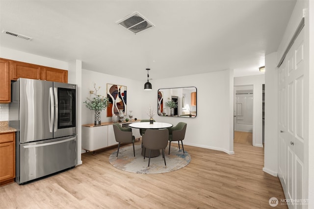 1116 30th St NE, Auburn, WA 98002 - dining space featuring light wood-style flooring and baseboards
