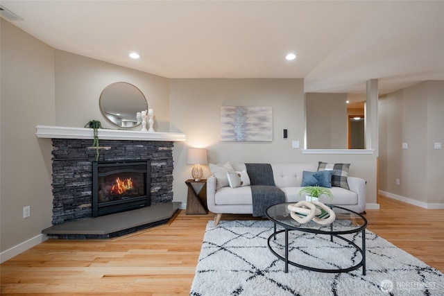 3918 Commencement Bay Dr, Tacoma, WA 98407 - living area featuring wood finished floors, a stone fireplace, and recessed lighting