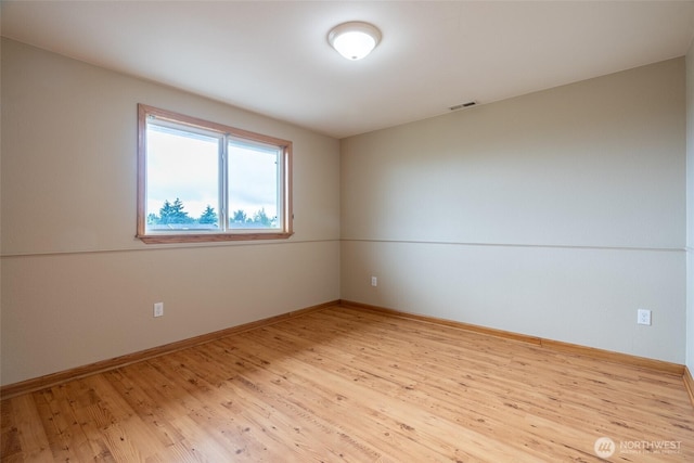3918 Commencement Bay Dr, Tacoma, WA 98407 - empty room with light wood finished floors and baseboards