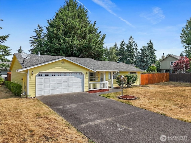 3117 243rd Street Ct E, Spanaway, WA 98387 - ranch-style house featuring a garage, driveway, a porch, and roof with shingles