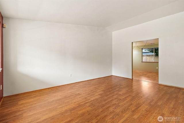 3117 243rd Street Ct E, Spanaway, WA 98387 - unfurnished room with wood finished floors and lofted ceiling