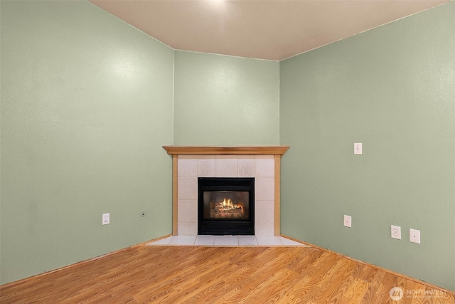 3117 243rd Street Ct E, Spanaway, WA 98387 - detailed view of wood finished floors and a tile fireplace