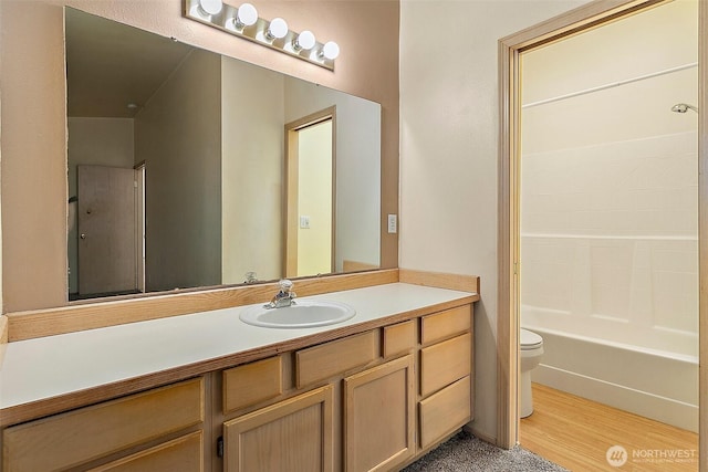 3117 243rd Street Ct E, Spanaway, WA 98387 - bathroom featuring vanity, wood finished floors, and bathing tub / shower combination