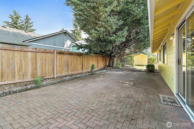 3117 243rd Street Ct E, Spanaway, WA 98387 - fenced backyard with a storage shed and a patio
