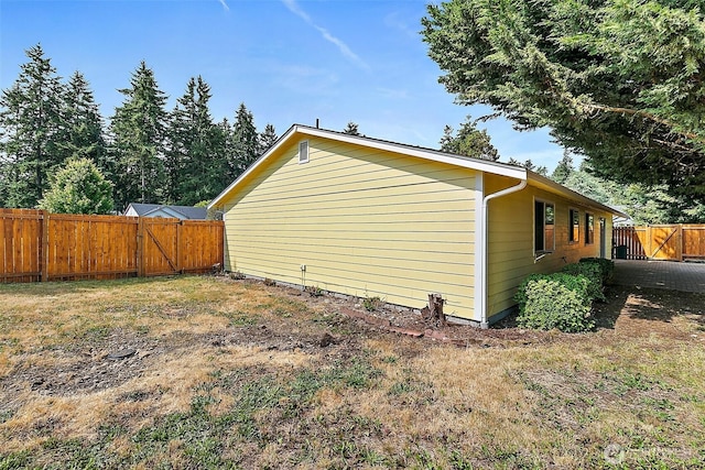 3117 243rd Street Ct E, Spanaway, WA 98387 - view of home's exterior with a fenced backyard and a gate