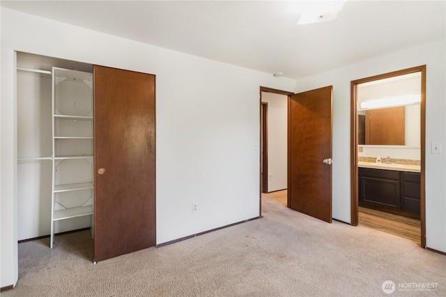 18552 15th Loop NE, Poulsbo, WA 98370 - unfurnished bedroom with light colored carpet, a closet, and ensuite bath