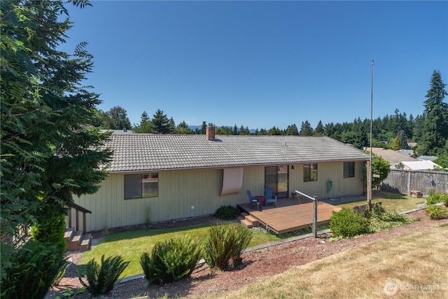 18552 15th Loop NE, Poulsbo, WA 98370 - rear view of house featuring a tile roof, a deck, and a chimney