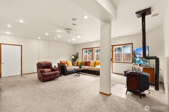 44520 SE 144th St, North Bend, WA 98045 - living room with light colored carpet, recessed lighting, a ceiling fan, and a wood stove
