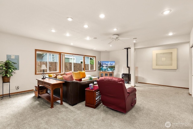 44520 SE 144th St, North Bend, WA 98045 - living area featuring a wood stove, light carpet, recessed lighting, and ceiling fan