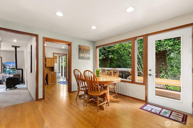 44520 SE 144th St, North Bend, WA 98045 - dining room featuring light wood-style flooring, recessed lighting, and a wood stove