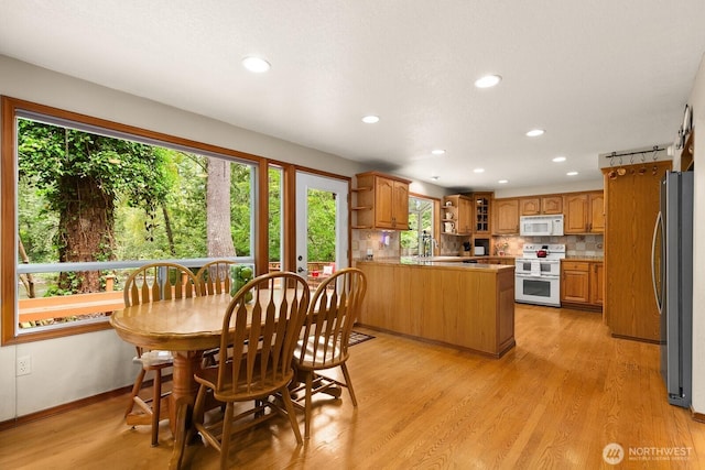 44520 SE 144th St, North Bend, WA 98045 - dining room featuring healthy amount of natural light, recessed lighting, and light wood-style flooring