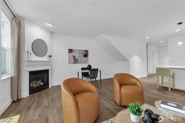 7549 SE 29th St Unit 301, Mercer Island, WA 98040 - living room featuring wood finished floors, a glass covered fireplace, and recessed lighting