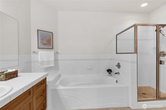 7549 SE 29th St Unit 301, Mercer Island, WA 98040 - bathroom with a bath, a stall shower, vanity, and recessed lighting