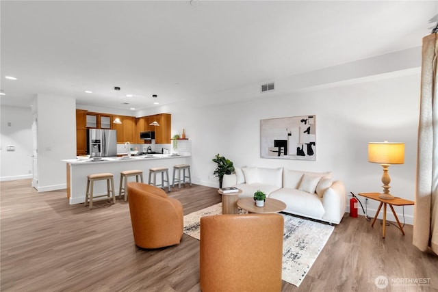 7549 SE 29th St Unit 301, Mercer Island, WA 98040 - living room with light wood-style floors and recessed lighting