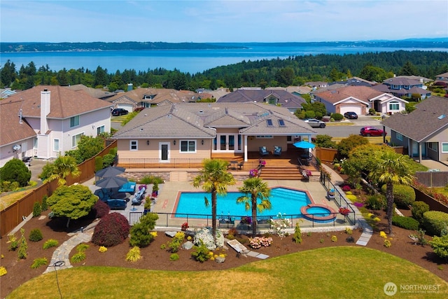 2014 Parkview Dr NE, Tacoma, WA 98422 - view of swimming pool with a fenced backyard, a pool with connected hot tub, a residential view, and a water view
