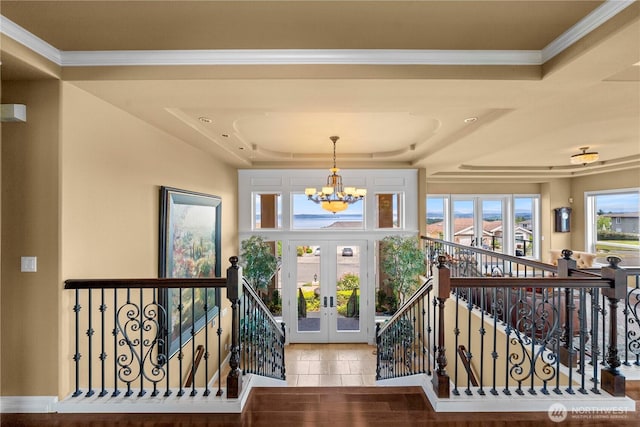 2014 Parkview Dr NE, Tacoma, WA 98422 - foyer entrance with a raised ceiling, a chandelier, french doors, and crown molding
