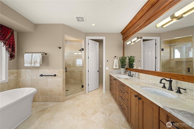 2014 Parkview Dr NE, Tacoma, WA 98422 - bathroom featuring a shower stall, double vanity, a freestanding tub, and recessed lighting