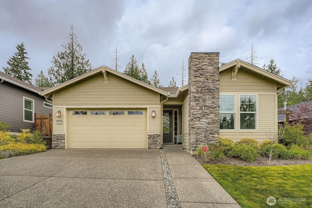18413 145th St E, Bonney Lake, WA 98391 - view of front of home with a garage, stone siding, driveway, and a chimney
