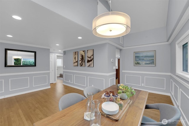 8410 9th Ave SW, Seattle, WA 98106 - dining space with a decorative wall, wood finished floors, recessed lighting, crown molding, and wainscoting