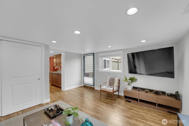8410 9th Ave SW, Seattle, WA 98106 - living area featuring light wood-style flooring and recessed lighting