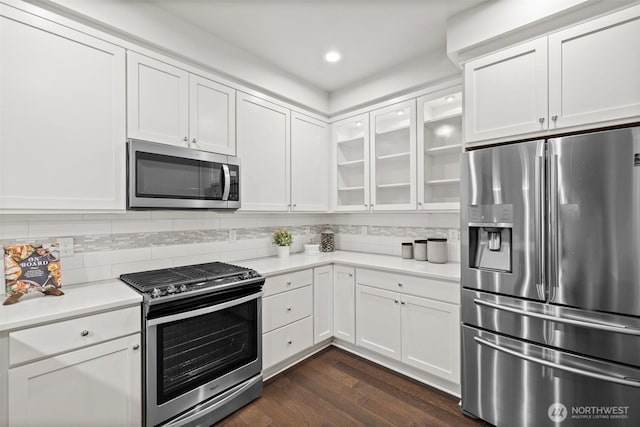 15791 NE 114th Way, Redmond, WA 98052 - kitchen featuring stainless steel appliances, light countertops, glass insert cabinets, white cabinetry, and recessed lighting