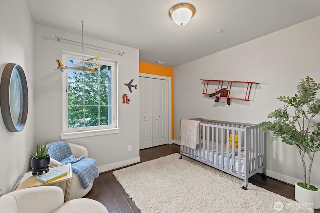 15791 NE 114th Way, Redmond, WA 98052 - bedroom featuring wood finished floors, a closet, and a crib