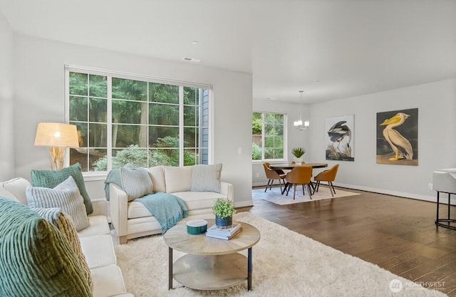 15791 NE 114th Way, Redmond, WA 98052 - living room featuring wood finished floors and a chandelier