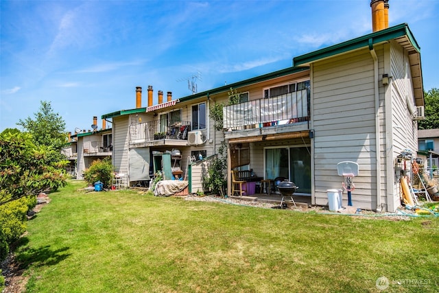 1102 8th St NE Unit 22, Auburn, WA 98002 - back of house featuring a balcony, a lawn, and cooling unit