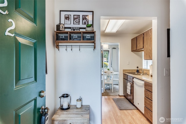 1102 8th St NE Unit 22, Auburn, WA 98002 - kitchen with dishwasher, light wood-type flooring, and light countertops