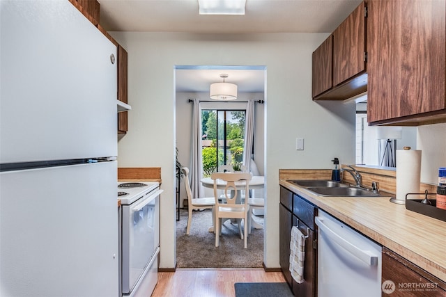 1102 8th St NE Unit 22, Auburn, WA 98002 - kitchen with white appliances, light countertops, and light wood finished floors