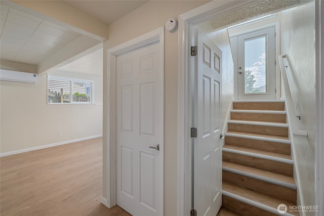 2117 S Majestic Dr, East Wenatchee, WA 98802 - stairs featuring a wall mounted air conditioner and wood finished floors