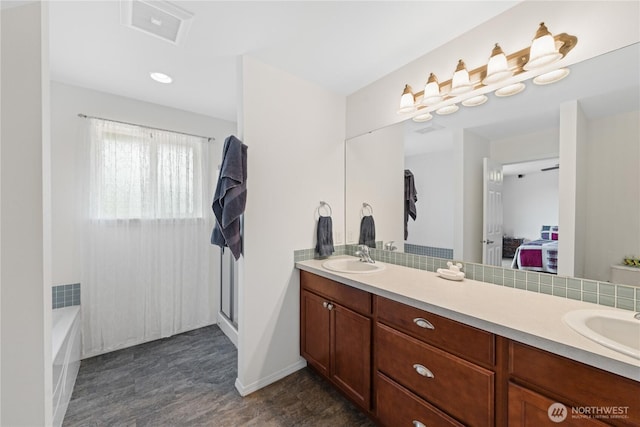 22655 Nature View Dr, Sedro Woolley, WA 98284 - bathroom featuring double vanity, a shower, a bathtub, and decorative backsplash