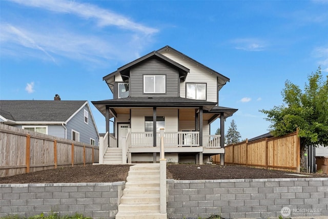 7812 S Sheridan Ave, Tacoma, WA 98408 - view of front of home with a porch, a fenced backyard, and stairs