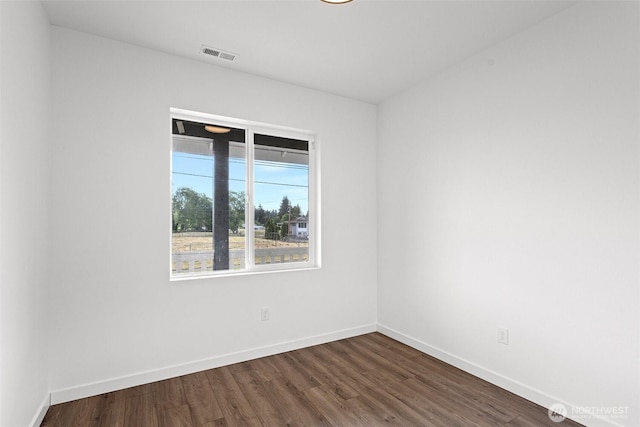 7812 S Sheridan Ave, Tacoma, WA 98408 - spare room featuring baseboards and dark wood-style floors