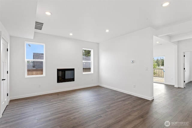 7812 S Sheridan Ave, Tacoma, WA 98408 - unfurnished living room featuring recessed lighting, dark wood-style flooring, and a glass covered fireplace