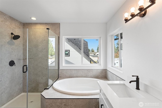 7812 S Sheridan Ave, Tacoma, WA 98408 - bathroom featuring healthy amount of natural light, a bath, a shower stall, and vanity
