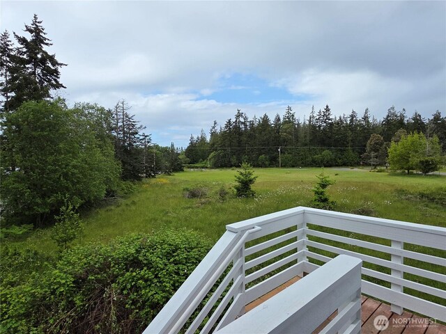 410 Eddy Ct, Port Townsend, WA 98368 - view of yard featuring a balcony and a wooded view