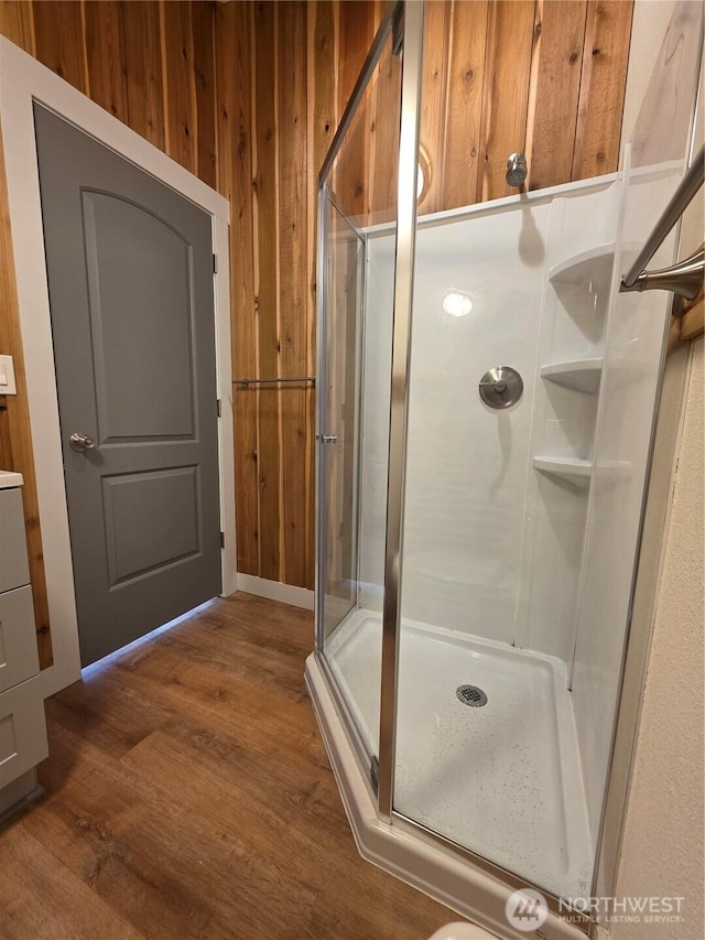 410 Eddy Ct, Port Townsend, WA 98368 - full bath with a stall shower, wood finished floors, and wood walls