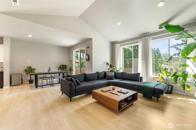 16712 8th Ave E, Spanaway, WA 98387 - living area with vaulted ceiling, light wood finished floors, and recessed lighting